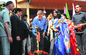 Chief Minister Omar Abdullah lights the traditional lamp at the inauguration of the Police-Public Mela at Bakshi Stadium in Srinagar on Sunday.