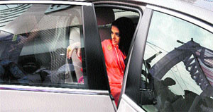 Actor Aishwarya Rai Bachchan looks at her waiting fans before alighting from a car in Ludhiana.