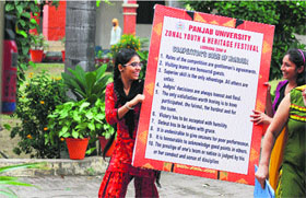Students make preparations for a youth festival that will begin on Monday at the Khalsa College for Women in Ludhiana on Sunday.