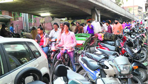Haphazardly parked two-wheelers lead to a traffic jam