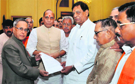 President Pranab Mukherjee with MPs, MLAs from Uttar Pradesh, led by BJP president Rajnath Singh, at Rashtrapati Bhawan in New Delhi on Sunday. 