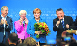 German Chancellor Angela Merkel (C) at the CDU party headquarters in Berlin on Sunday.