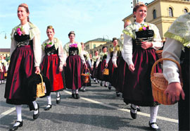 Women take part in the traditional costume parade of the Bavarian Oktoberfest beer festival in Munich on Sunday. The world's biggest beer festival will run till October 6.