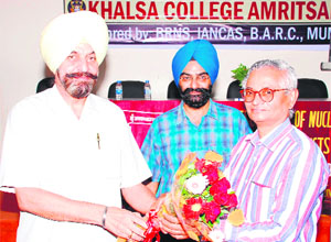 Principal Dr Daljit Singh welcomes Dr DN Sharma, member of International Atomic Energy Agency (IAEA), at the 83rd National Workshop on Radiochemistry and Applications of Radioisotopes (NWRAR) at Khalsa College in Amritsar on Monday. 