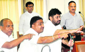 Councillors make a point during an MC House meeting on Monday.