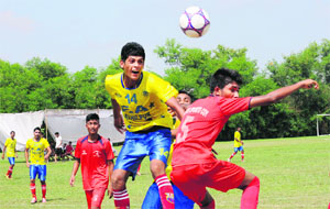 Players in action during a match at the Football Stadium, Sector 42, in Chandigarh on Monday. 