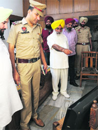 Sewa Singh Sekhwan, former Education Minister, Punjab, looks at the CCTV footage after a theft at his house in Sector 71, Mohali, on Monday