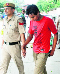One of the accused, Bunty, being produced in a court in Panchkula on Monday.