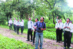 IHM faculty members and students during a bird- watching camp at Jhajra Reserve Forest on Monday. A Tribune photograph