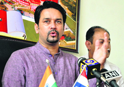 HPCA president Anurag Thakur addresses mediapersons in Dharamsala on Monday.