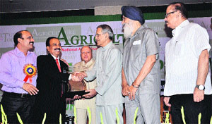 Uttar Pradesh Governor BL Joshi gives away the Agriculture Leadership Awards-2013 to NDRI Director Dr AK Srivastava in New Delhi. Punjab Chief Minister Parkash Singh Badal was also present on the occasion. 