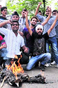 Students stage protest against MAM PG College administration and Higher Education Minister in Jammu on Monday.