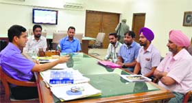 Representatives of the teachers union with Deputy Commissioner Rajat Aggarwal in Ludhiana on Monday.