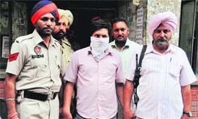 Accused Karanvir Singh, alias Ujwal, in police custody in Ludhiana.