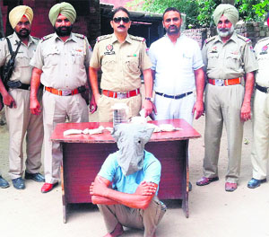 Kulwinder Singh, from whom a China-made .30-bore pistol, five cartridges, 600 gm of intoxicant powder and fake currency was recovered, in police net in Amritsar on Tuesday. 