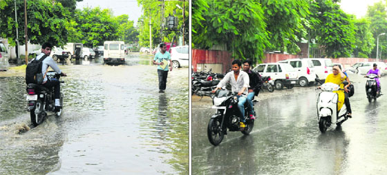(Left) Several main and link roads in the city were waterlogged after a brief spell of rain on Tuesday afternoon; and commuters brave the rain on a city road. 