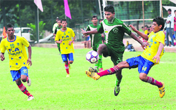 Players in action at the Administrator's Football Cup at Sector 42, Chandigarh, on Tuesday. Tribune photo: Parvesh Chauhan