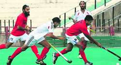 Players in action at the SN Vohra's All-India Gurmit Memorial Hockey Tournament at the hockey stadium in Sector 42, Chandigarh, on Tuesday. Tribune photo: Parvesh Chauhan