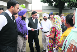Honourable District and Sessions Judge, Chandigarh, along with Chief Judicial Magistrate of Chandigarh and other Judicial Magistrates and the District Attorney of the UT, Chandigarh, listen to grievances at the Burail Jail in Chandigarh on Tuesday. A Tribune photograph