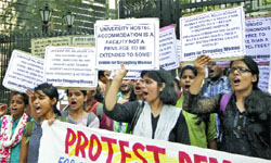 DU students stage a demonstration outside the HRD Ministry at Shastri Bhawan to protest against the lack of adequate and affordable hostel accommodation in New Delhi on Tuesday. 