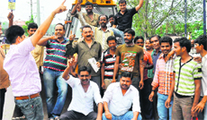 Local advertisers stage a protest against the Haridwar Municipal Corporation on Tuesday. 