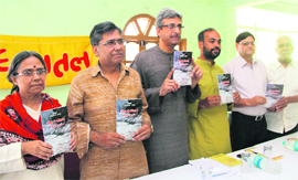 Dignitaries release a book by Dr Atul Sharma (second from left) in Dehradun on Tuesday.