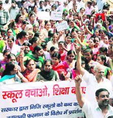 Owners and teachers of private schools hold a demonstration in Gurgaon on Tuesday.