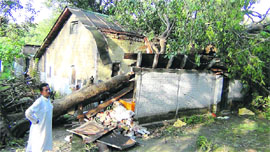 A house damaged by heavy rain and storm in Pragpur block of Kangra district