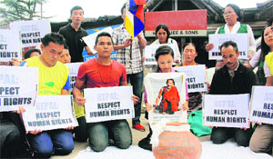 Tibetans hold a demonstration at McLeodganj on Tuesday.