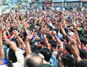 Residents of Shopian district hold a protest demanding the removal of the CRPF camp from Gagren village on Tuesday.