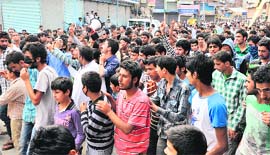 Residents take to the streets demanding removal of CRPF camp from Gagren village in Shopian on Tuesday.