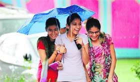 Girls enjoy the rain at the Khalsa College for Women