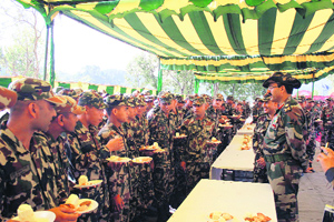 Indian and Nepalese soldiers interact during the joint military exercise in Pithoragarh district of Uttarakhand on Tuesday