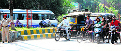 The police stops the vehicular movement outside Khazana Gate by tying ropes to clear the passage for Deputy Chief Minister Sukhbir Singh Badal's cavalcade in Amritsar on Wednesday