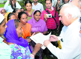 A self-help group's mid-day meal cooks submit a memorandum of demands to Union Minister Kapil Sibal at the SSD College in Bathinda on Wednesday.