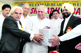 Union Minister Kapil Sibal being presented a memento at a function held at the District Court Complex in Bathinda on Wednesday.
