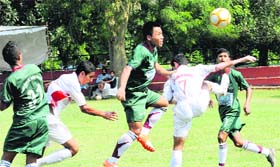 Players in action during  a  match of the All-India Administrators Football Cup at the football grounds in Chandigarh on Wednesday
