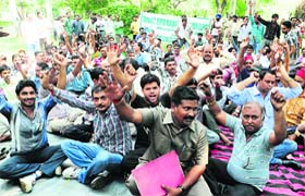 The agitating LPG auto-rickshaw owners at the Sector 34 police station in Chandigarh on Wednesday