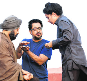 Director Anup Singh (middle) explains a scene on the sets of Qissa