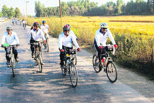 Cyclists from different states participate in a cross-country (Kashmir to Kanyakumari) race in Awantipora in Pulwama district on Wednesday. 