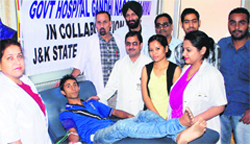A volunteer donates blood at a camp at Government Hospital, Gandhi Nagar, in Jammu on Wednesday. Tribune Photo: Inderjeet Singh