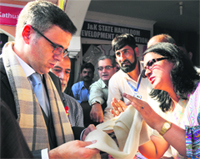 Chief Minister Omar Abdullah visits a stall on the inaugural day of the Handloom Expo 2013 at Kashmir Haat, Exhibition Ground, in Srinagar on Wednesday. Tribune Photo: Amin War