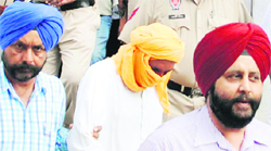 Accused Tarwinder Singh in police custody in Amritsar on Wednesday. Photo: Vishal Kumar