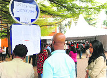 People look at a list of the Westgate mall attack victims outside a hospital in Nairobi on Tuesday.