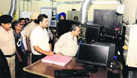 Officials arrive at the office of PVR Cinemas to seal it at the Elante mall in Chandigarh on Thursday.