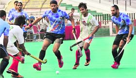 Players in action during a match at the Hockey Stadium, Sector 42, in Chandigarh on Thursday.