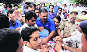 ABVP workers and police personnel clash during a protest in Dehradun on Thursday. 