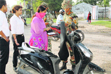 Army men check documents of a commuter in Ambala Cantonment on Thursday.
