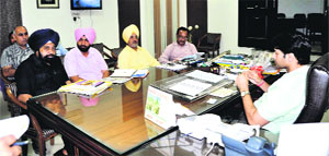 Varun Roojam, Deputy Commissioner, meets the officials in Jalandhar on Thursday. 