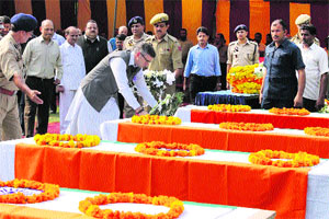 Chief Minister Omar Abdullah lays a wreath on the coffin of a martyr at the Police Headquarters in Jammu on Thursday. 